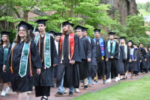Students walking in graduation cap and gown
